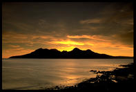 Sunset over the island of Rum - photographed from Eigg